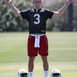 Arizona Cardinals' first-round draft pick Josh Rosen stretches during NFL football rookie camp Friday, May 11, 2018, in Tempe, Ariz. (AP Photo/Matt York)