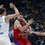 CSKA Moscow's Nikita Kurbanov, center, drives to the basket as Real Madrid's Luka Doncic, left, and Facundo Campazzo trie to block him during their Final Four Euroleague semifinal basketball match in Belgrade, Serbia, Friday, May 18, 2018. (AP Photo/Darko Vojinovic)