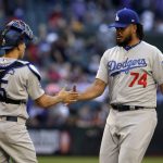 Los Angeles Dodgers relief pitcher Kenley Jansen (74) celebrates with Austin Barnes after the Dodgers defeated the Arizona Diamondbacks 5-2 in a baseball game, Thursday, May 3, 2018, in Phoenix. (AP Photo/Rick Scuteri)