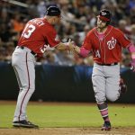 Washington Nationals Mark Raynolds (14) celebrates with Bob Henley after hitting a two run home run against the Arizona Diamondbacks in the eighth inning during a baseball game, Sunday, May 13, 2018, in Phoenix. (AP Photo/Rick Scuteri)