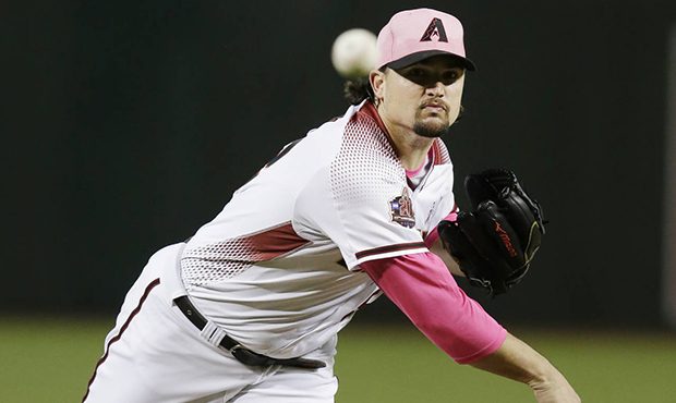 Arizona Diamondbacks pitcher Zack Godley throws in the first inning during a baseball game against ...