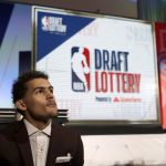 Area Young from Oklahoma looks over the ballroom at the Palmer House Hilton before the NBA basketball draft lottery Tuesday, May 15, 2018, in Chicago. (AP Photo/Charles Rex Arbogast)