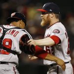 Washington Nationals relief pitcher Sean Doolittle (62) celebrates with catcher Pedro Severino (29) after the final out of the 11th inning of a baseball game against the Arizona Diamondbacks Thursday, May 10, 2018, in Phoenix. The Nationals defeated the Diamondbacks 2-1. (AP Photo/Ross D. Franklin)