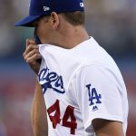 Los Angeles Dodgers starting pitcher Rich Hill wipes his face as he walks back to the dugout in the middle of the first inning of the team's baseball game against the Arizona Diamondbacks in Los Angeles, Tuesday, May 8, 2018. (AP Photo/Kelvin Kuo)
