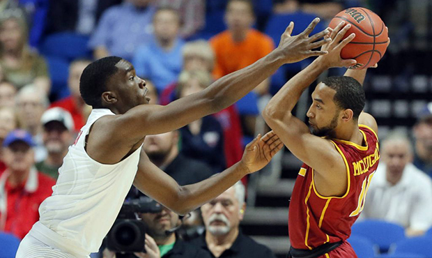 SMU's Shake Milton, left, defends as USC's Jordan McLaughlin prepares to make a pass in the first h...