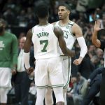 Boston Celtics forward Jayson Tatum, center right, celebrates his basket with guard Jaylen Brown (7) during the first half in Game 7 of the NBA basketball Eastern Conference finals against the Cleveland Cavaliers, Sunday, May 27, 2018, in Boston. (AP Photo/Elise Amendola)