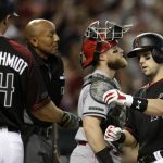 Arizona Diamondbacks' Chris Owings celebrates with Paul Goldschmidt (44) after hitting a three-run home run in the fifth inning during a baseball game against the Cincinnati Reds, Monday, May 28, 2018, in Phoenix. (AP Photo/Rick Scuteri)
