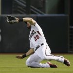 Arizona Diamondbacks right fielder Steven Souza Jr. makes a diving catch on a fly ball hit by Milwaukee Brewers' Jesus Aguilar during the first inning of a baseball game Wednesday, May 16, 2018, in Phoenix. (AP Photo/Ross D. Franklin)