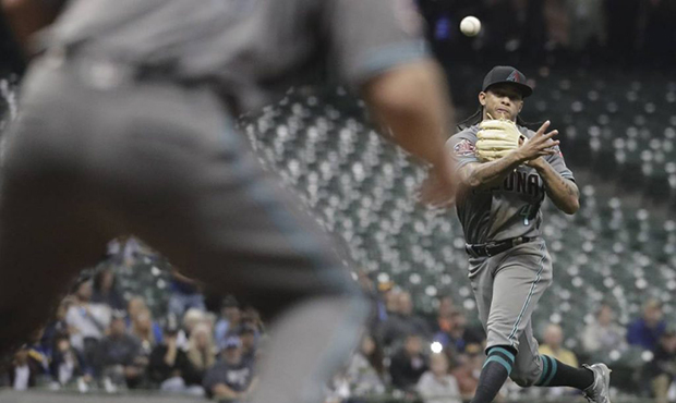 Arizona Diamondbacks' Ketel Marte makes a play on a ball hit by Milwaukee Brewers' Travis Shaw duri...