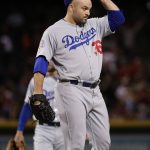 
              Los Angeles Dodgers relief pitcher Adam Liberatore adjusts his cap after giving up a two-run triple to the Arizona Diamondbacks during the seventh inning of a baseball game Tuesday, May 1, 2018, in Phoenix. (AP Photo/Matt York)
            