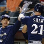 Milwaukee Brewers' Travis Shaw (21) celebrates his two-run home run against the Arizona Diamondbacks with manager Craig Counsell, left, during the first inning of a baseball game Wednesday, May 16, 2018, in Phoenix. (AP Photo/Ross D. Franklin)
