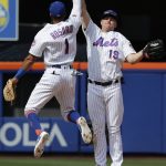 New York Mets' Amed Rosario (1) celebrates with teammate Jay Bruce (19) after a baseball game against the Arizona Diamondbacks, Sunday, May 20, 2018, in New York. (AP Photo/Frank Franklin II)