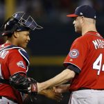Washington Nationals relief pitcher Ryan Madson (44) and catcher Pedro Severino, left, celebrate after the final out of the ninth inning of a baseball game against the Arizona Diamondbacks Saturday, May 12, 2018, in Phoenix. The Nationals defeated the Diamondbacks 2-1. (AP Photo/Ross D. Franklin)