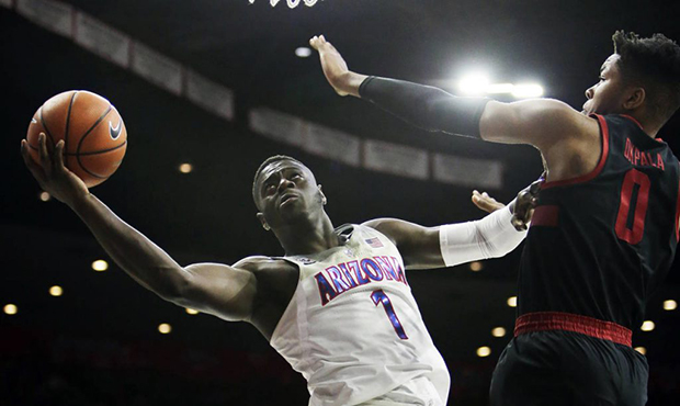 FILE - In this March 1, 2018, file photo, Arizona guard Rawle Alkins (1) drives on Stanford's Kezie...