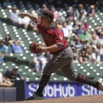 Arizona Diamondbacks starting pitcher Zack Godley throws during the first inning of a baseball game against the Milwaukee Brewers Wednesday, May 23, 2018, in Milwaukee. (AP Photo/Morry Gash)