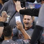 Arizona Diamondbacks' Nick Ahmed is congratulated by teammates after his inside-the-park home run during the first inning of a baseball game against the Los Angeles Dodgers on Wednesday, May 9, 2018, in Los Angeles. (AP Photo/Mark J. Terrill)