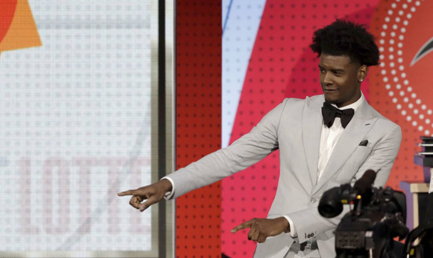 Phoenix Suns forward Josh Jackson reacts after the team won the first pick of the 2018 NBA Draft du...