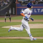 New York Mets' Michael Conforto makes his way up the first base line after hitting a two-run home run against the Arizona Diamondbacks during the second inning of a baseball game, Saturday, May 19, 2018, in New York. (AP Photo/Julie Jacobson)
