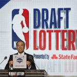 NBA Deputy Commissioner Mark Tatum announces that the Charlotte Hornets won the 11th pick during the NBA basketball draft lottery Tuesday, May 15, 2018, in Chicago. (AP Photo/Charles Rex Arbogast)