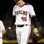 Arizona Diamondbacks starting pitcher Patrick Corbin (46) looks down after loading the bases against the Cincinnati Reds during the fourth inning of a baseball game Wednesday, May 30, 2018, in Phoenix. (AP Photo/Matt York)
