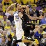 Cleveland Cavaliers guard Jordan Clarkson, foreground, loses the ball in front of Golden State Warriors guard Shaun Livingston during the first half of Game 1 of basketball's NBA Finals in Oakland, Calif., Thursday, May 31, 2018. (AP Photo/Marcio Jose Sanchez)