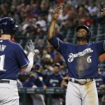 Milwaukee Brewers' Travis Shaw (21) celebrates his two-run home run against the Arizona Diamondbacks with teammate Lorenzo Cain (6) during the first inning of a baseball game Wednesday, May 16, 2018, in Phoenix. (AP Photo/Ross D. Franklin)