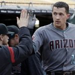 Arizona Diamondbacks' Nick Ahmed receives a high-five in the dugout after hitting a solo home run against the Oakland Athletics during the first inning of a baseball game Friday, May 25, 2018, in Oakland, Calif. (AP Photo/Marcio Jose Sanchez)