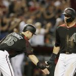 Arizona Diamondbacks Nick Ahmed celebrates with Chris Owings (16) after hitting a three-run home run against the Cincinnati Reds in the second inning during a baseball game, Monday, May 28, 2018, in Phoenix. (AP Photo/Rick Scuteri)