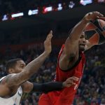 CSKA Moscow's Kyle Hines, right, jumps for a lost ball as Real Madrid's Trey Thompkins tries to block him during their Final Four Euroleague semifinal basketball match in Belgrade, Serbia, Friday, May 18, 2018. (AP Photo/Darko Vojinovic)