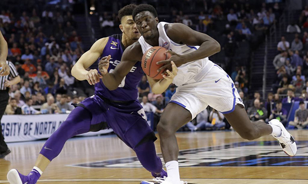 Kansas State's Mike McGuirl, left, knocks the ball from Creighton's Khyri Thomas, right, during the...