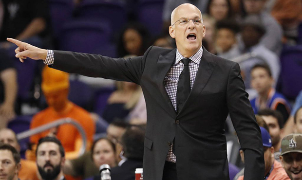 Phoenix Suns head coach Jay Triano yells during the first half of an NBA basketball game against th...