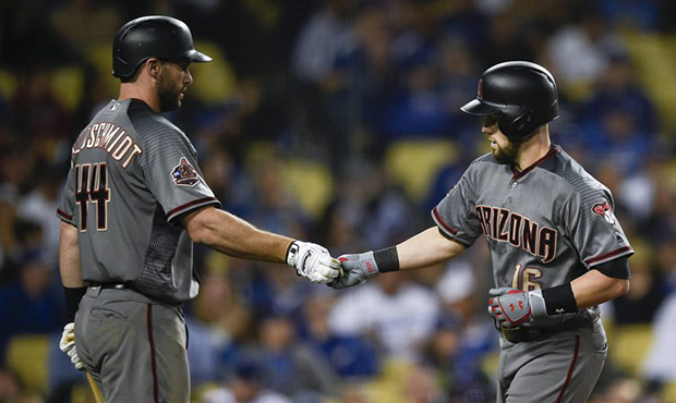 Arizona Diamondbacks' Chris Owings, right, celebrates with Paul Goldschmidt after hitting a solo ho...