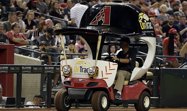 The Arizona Diamondbacks' bullpen cart is driven on the warning track during the eighth inning of t...