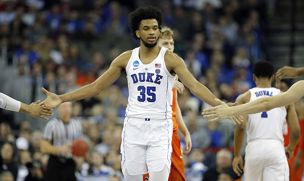 Duke's Marvin Bagley III is congratulated by teammates during the second half of a regional semifin...