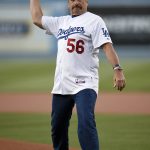 Los Angeles Police Chief Charlie Beck throws out the ceremonial first pitch prior to a baseball game between the Los Angeles Dodgers and the Arizona Diamondbacks in Los Angeles, Tuesday, May 8, 2018. (AP Photo/Kelvin Kuo)