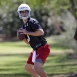 Arizona Cardinals' first-round draft pick Josh Rosen (3) runs drills during NFL football football rookie camp Friday, May 11, 2018, in Tempe, Ariz. (AP Photo/Matt York)