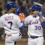 New York Mets' Michael Conforto (30) celebrates with Jose Reyes (7) after hitting a two-run home run against the Arizona Diamondbacks during the second inning of a baseball game, Saturday, May 19, 2018, in New York. (AP Photo/Julie Jacobson)