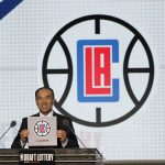 NBA Deputy Commissioner Mark Tatum announces that the Los Angeles Clippers had won the 12th and 13th picks during the NBA basketball draft lottery Tuesday, May 15, 2018, in Chicago. (AP Photo/Charles Rex Arbogast)