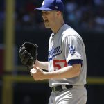 Los Angeles Dodgers pitcher Alex Wood reacts after a warm up pitch in the fifth inning of a baseball game against the Arizona Diamondbacks, Thursday, May 3, 2018, in Phoenix. (AP Photo/Rick Scuteri)