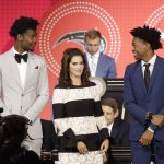 Josh Jackson, left, representing the Phoenix Suns, Jami Gertz, center, representing the Atlanta Hawks, and De'Aaron Fox, representing the Sacramento Kings, wait for the announcement of the top three picks in the 2018 NBA during the NBA basketball draft lottery Tuesday, May 15, 2018, in Chicago. (AP Photo/Charles Rex Arbogast)