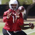 Arizona Cardinals' Larry Fitzgerald (11) makes a catch during an organized team activity at the NFL football team's training facility, Tuesday, May 15, 2018, in Tempe, Ariz. (AP Photo/Matt York)
