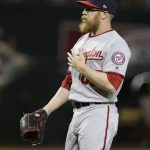 Washington Nationals relief pitcher Sean Doolittle gestures after the Nationals defeated the Arizona Diamondbacks 3-1 in a baseball game Friday, May 11, 2018, in Phoenix. (AP Photo/Rick Scuteri)