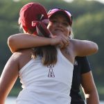 Alabama's Angelica Moresco, front, embraces Arizona's Sandra Nordaas after Nordass defeated her in match play during the final round of the NCAA Division I women's golf championship in Stillwater, Okla., Wednesday, May 23, 2018. Arizona won the title. (AP Photo/Sue Ogrocki)
