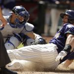 Arizona Diamondbacks Paul Goldschmidt (44) scores in front of Los Angeles Dodgers catcher Austin Barnes during the sixth inning during a baseball game Thursday, May 3, 2018, in Phoenix. (AP Photo/Rick Scuteri)