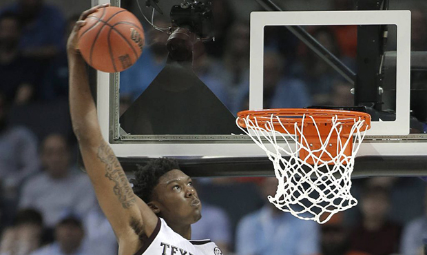 Texas A&M's Robert Williams (44) dunks against Providence during the second half of a first-round g...