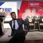 DeAndre Ayton from Arizona sits on the stage before the NBA basketball draft lottery Tuesday, May 15, 2018, in Chicago. (AP Photo/Charles Rex Arbogast)