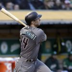 Arizona Diamondbacks' Paul Goldschmidt watches his two-run triple against the Oakland Athletics during the fourth inning of a baseball game Friday, May 25, 2018, in Oakland, Calif. (AP Photo/Marcio Jose Sanchez)