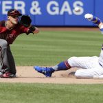 Arizona Diamondbacks shortstop Nick Ahmed, left, waits for the ball as New York Mets' Brandon Nimmo (9) steals second base during the seventh inning of a baseball game Sunday, May 20, 2018, in New York. (AP Photo/Frank Franklin II)