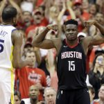 Houston Rockets center Clint Capela (15) celebrates after he scored against Golden State Warriors forward Kevin Durant (35) during the first half in Game 7 of the NBA basketball Western Conference finals, Monday, May 28, 2018, in Houston. (AP Photo/David Phillip)