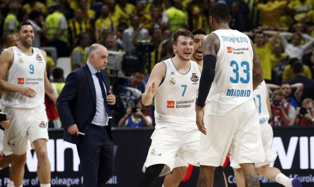 Real Madrid's Luka Doncic reacts with Real Madrid's Trey Thompkins after winning their Final Four E...